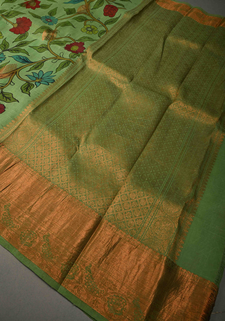 Floral Theme :  Pastel Green Kalamkari on Pure Kanjivaram Silk Saree with Contrast Zari Border | SILK MARK CERTIFIED | SHOBITAM