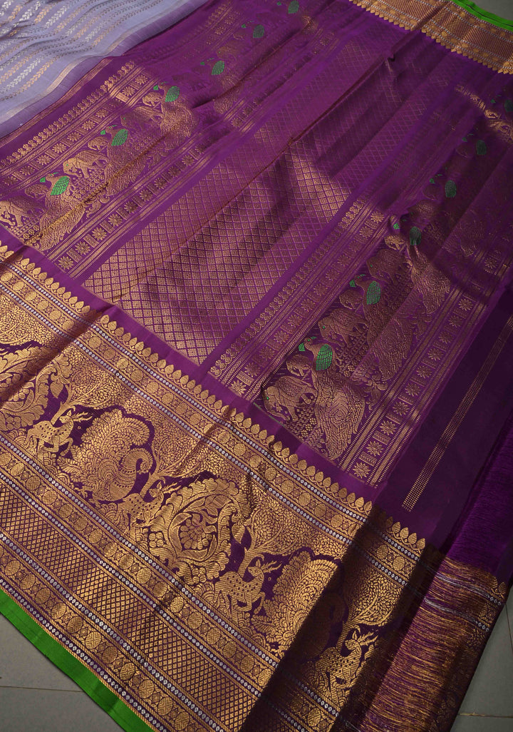 Dusty Lilac Dual tone Pure Gadwal Silk Saree with Gold & Silver Ornate Zari Stripes and 12" Contrast Wide Zari Border | SILK MARK CERTIFIED | SHOBITAM