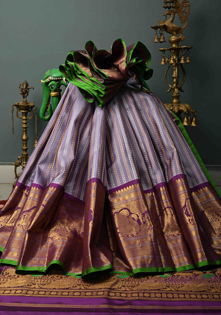 Dusty Lilac Dual tone Pure Gadwal Silk Saree with Gold & Silver Ornate Zari Stripes and 12" Contrast Wide Zari Border | SILK MARK CERTIFIED | SHOBITAM