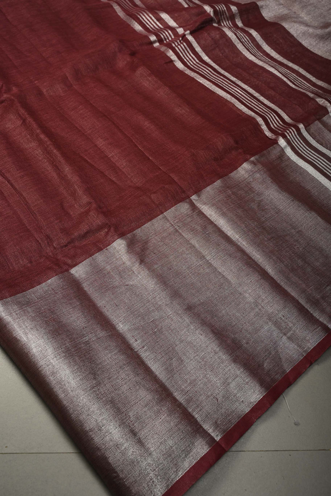 Maroon Linen Saree with Silver Zari Border | SHOBITAM