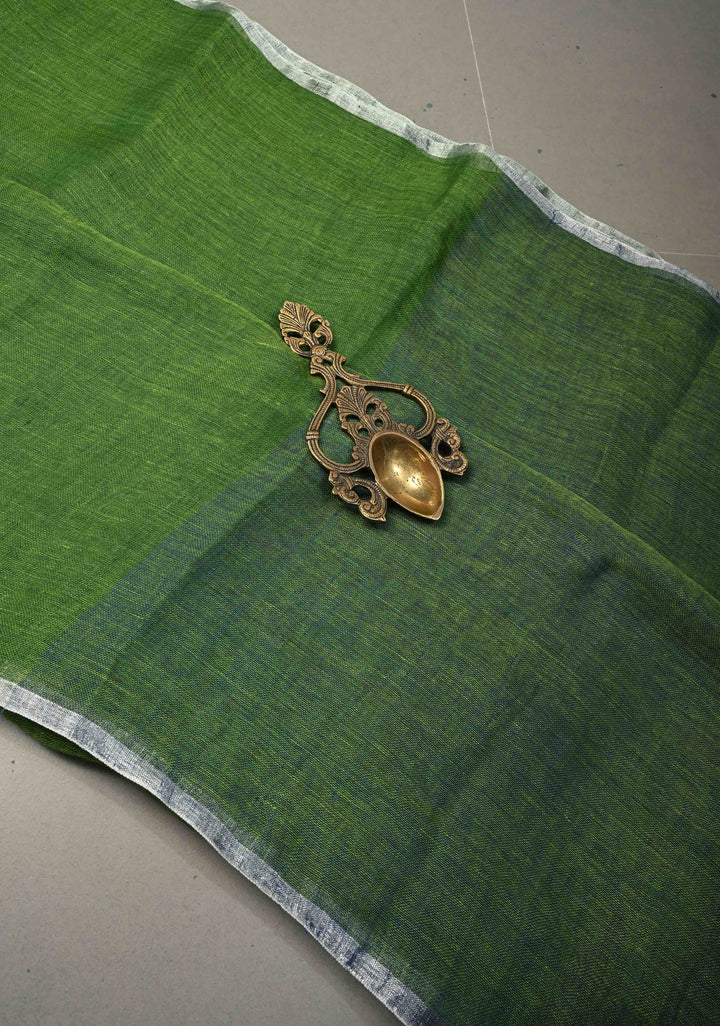 Grass Green Handloom Linen by Linen Saree with Minimal Tissue Border and Honeycomb Tassels | SHOBITAM
