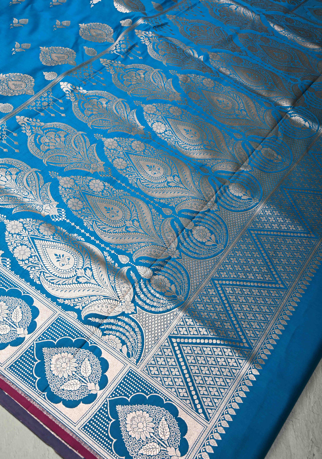 Sapphire Blue Banarasi Semi Mashru Silk Saree with Floral Silver Buttas and Zari Border