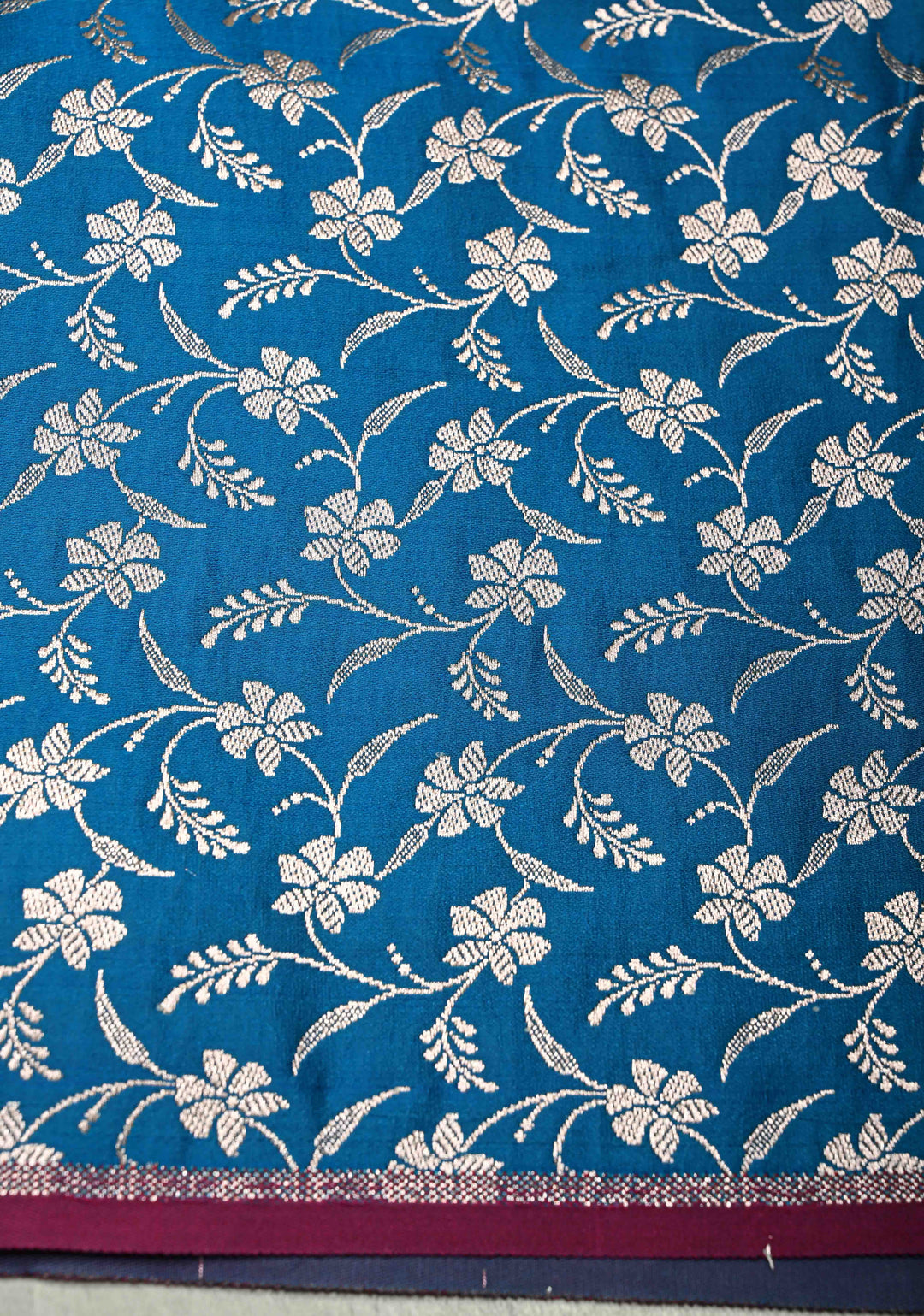 Sapphire Blue Banarasi Semi Mashru Silk Saree with Floral Silver Buttas and Zari Border