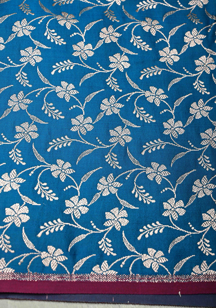Sapphire Blue Banarasi Semi Mashru Silk Saree with Floral Silver Buttas and Zari Border