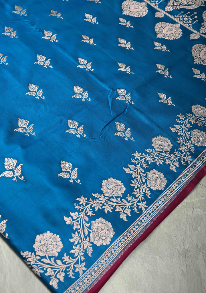 Sapphire Blue Banarasi Semi Mashru Silk Saree with Floral Silver Buttas and Zari Border