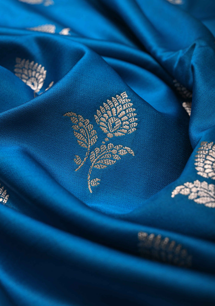 Sapphire Blue Banarasi Semi Mashru Silk Saree with Floral Silver Buttas and Zari Border