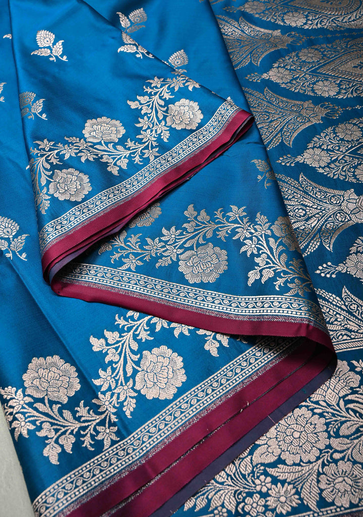 Sapphire Blue Banarasi Semi Mashru Silk Saree with Floral Silver Buttas and Zari Border