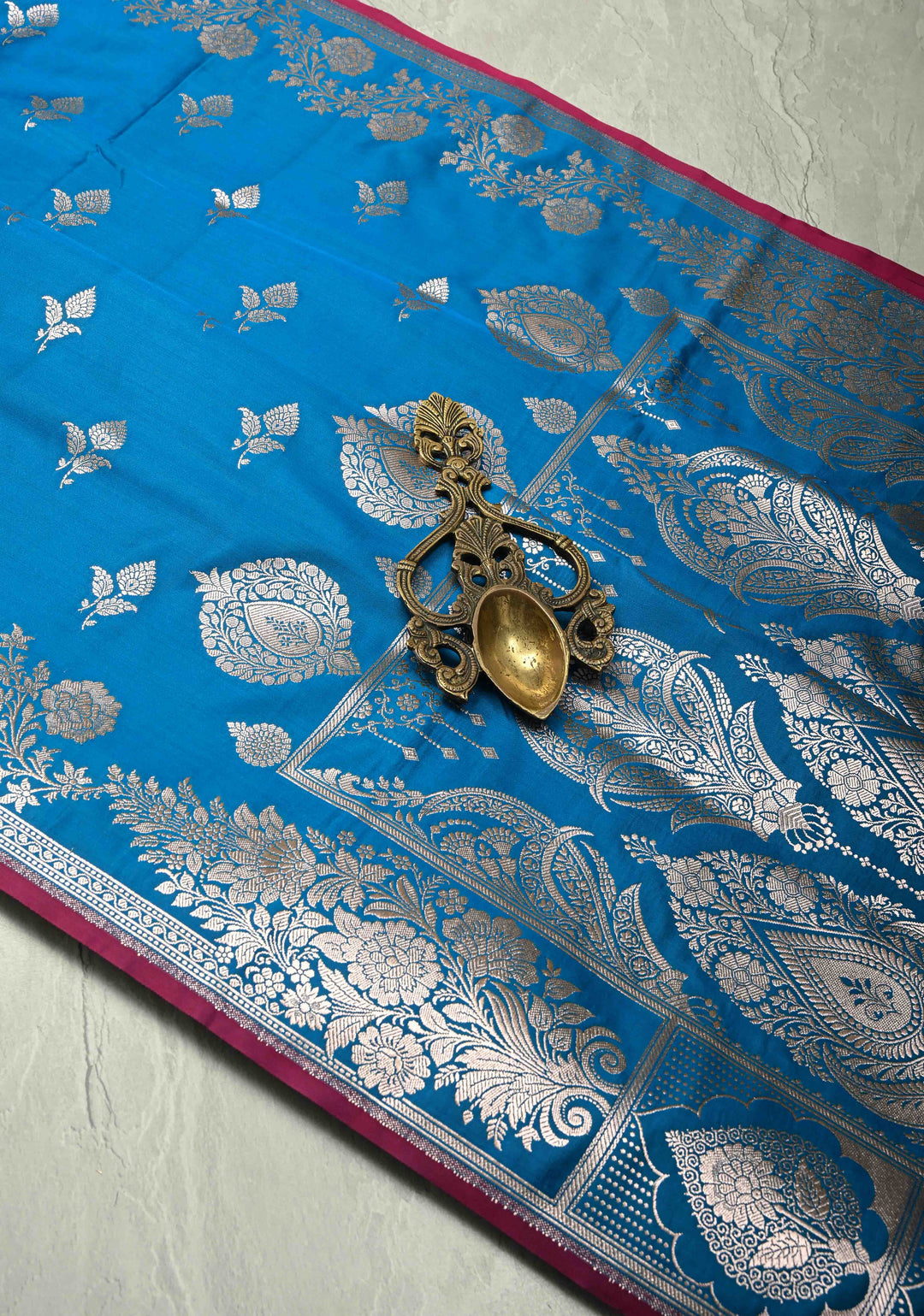 Sapphire Blue Banarasi Semi Mashru Silk Saree with Floral Silver Buttas and Zari Border