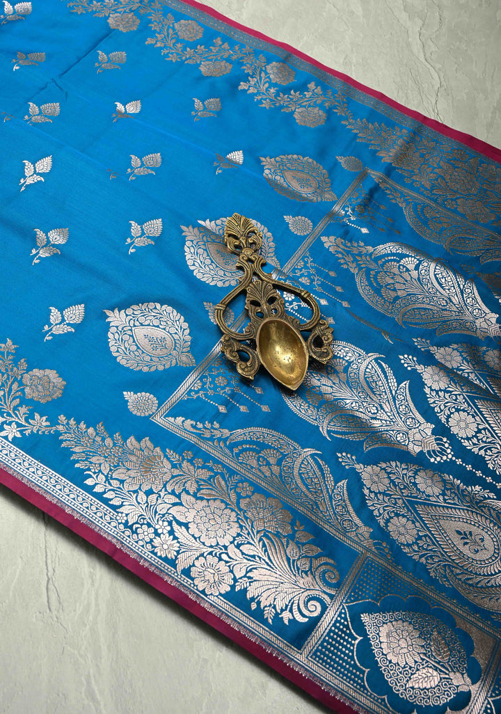 Sapphire Blue Banarasi Semi Mashru Silk Saree with Floral Silver Buttas and Zari Border