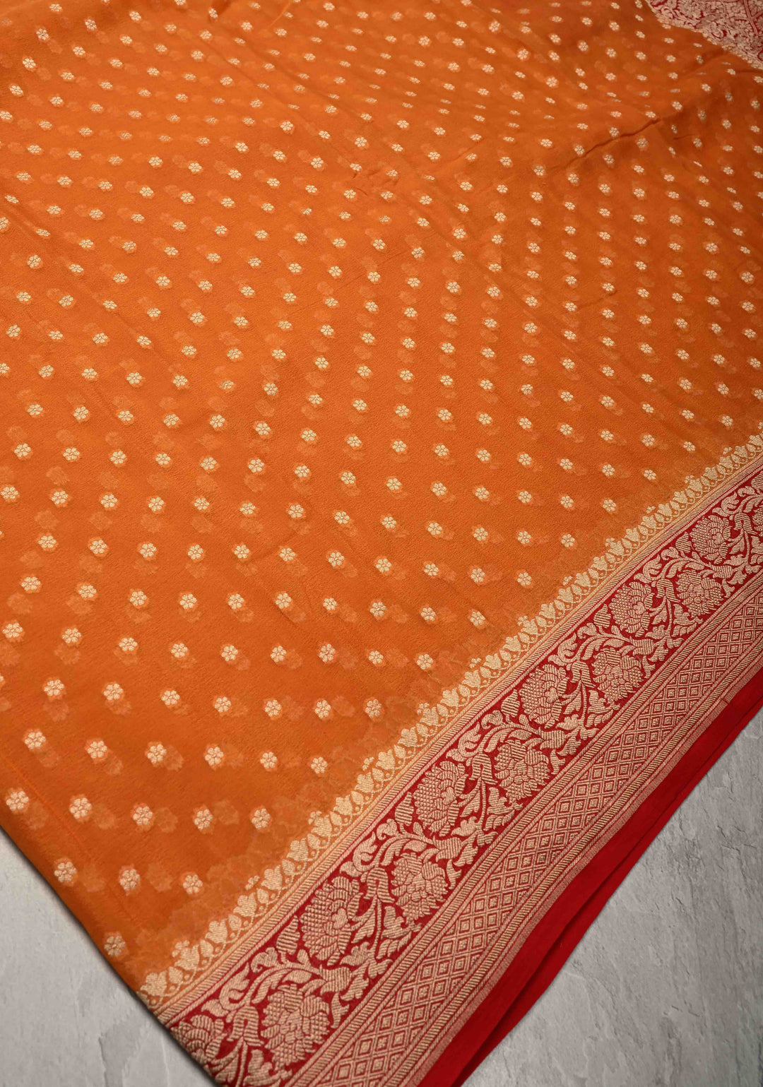 Orange Banarasi Georgette Silk Saree with Floral Butta and Contrast Zari Border | SILK MARK CERTIFIED