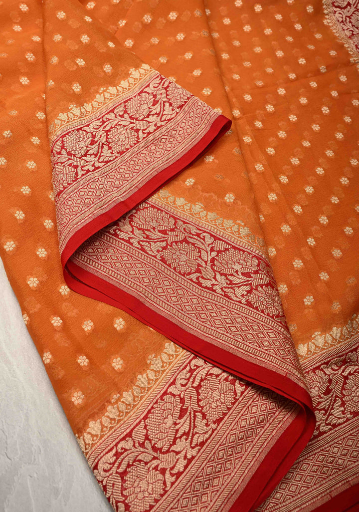 Orange Banarasi Georgette Silk Saree with Floral Butta and Contrast Zari Border | SILK MARK CERTIFIED