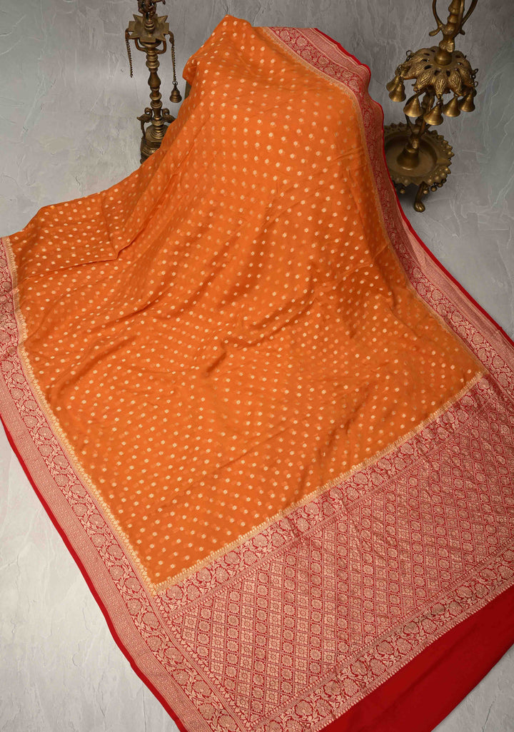 Orange Banarasi Georgette Silk Saree with Floral Butta and Contrast Zari Border | SILK MARK CERTIFIED