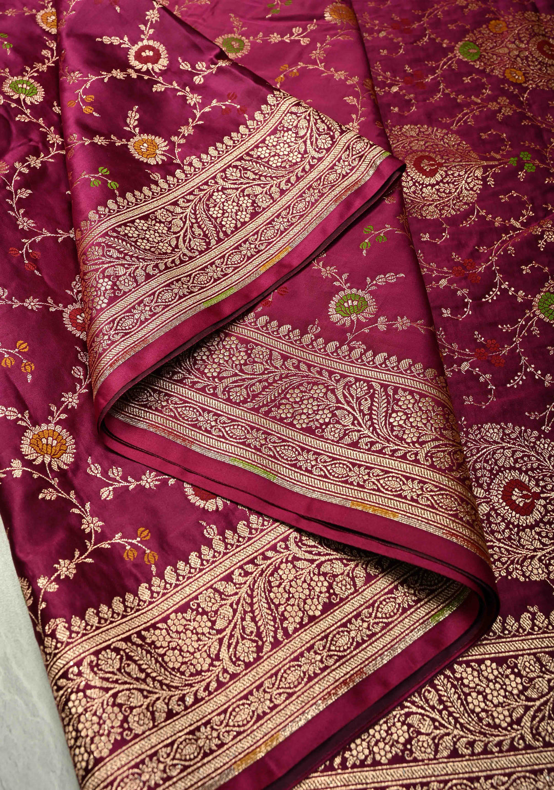 Plum Banarasi Semi Mashru Silk Saree with  Meenakari jaal Design and Bright Gold Zari detailing