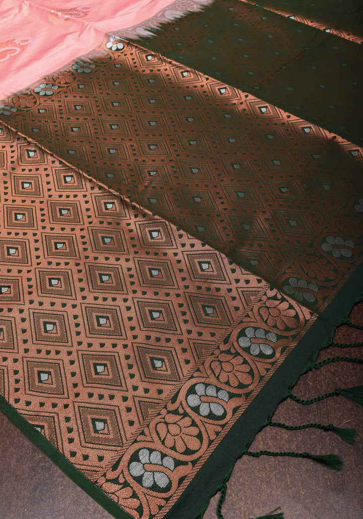 Graceful Peachy-Pink Semi  Silk Saree with Intricate Golden Motifs and Contrast Green Border
