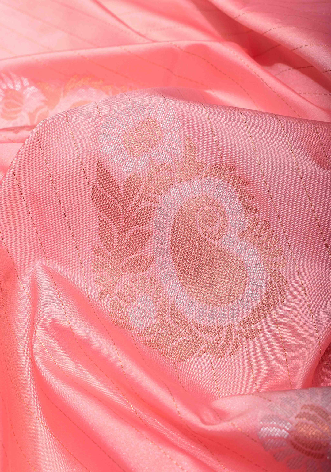 Graceful Peachy-Pink Semi  Silk Saree with Intricate Golden Motifs and Contrast Green Border