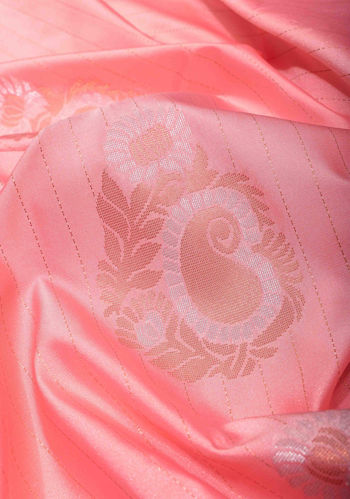 Graceful Peachy-Pink Semi  Silk Saree with Intricate Golden Motifs and Contrast Green Border