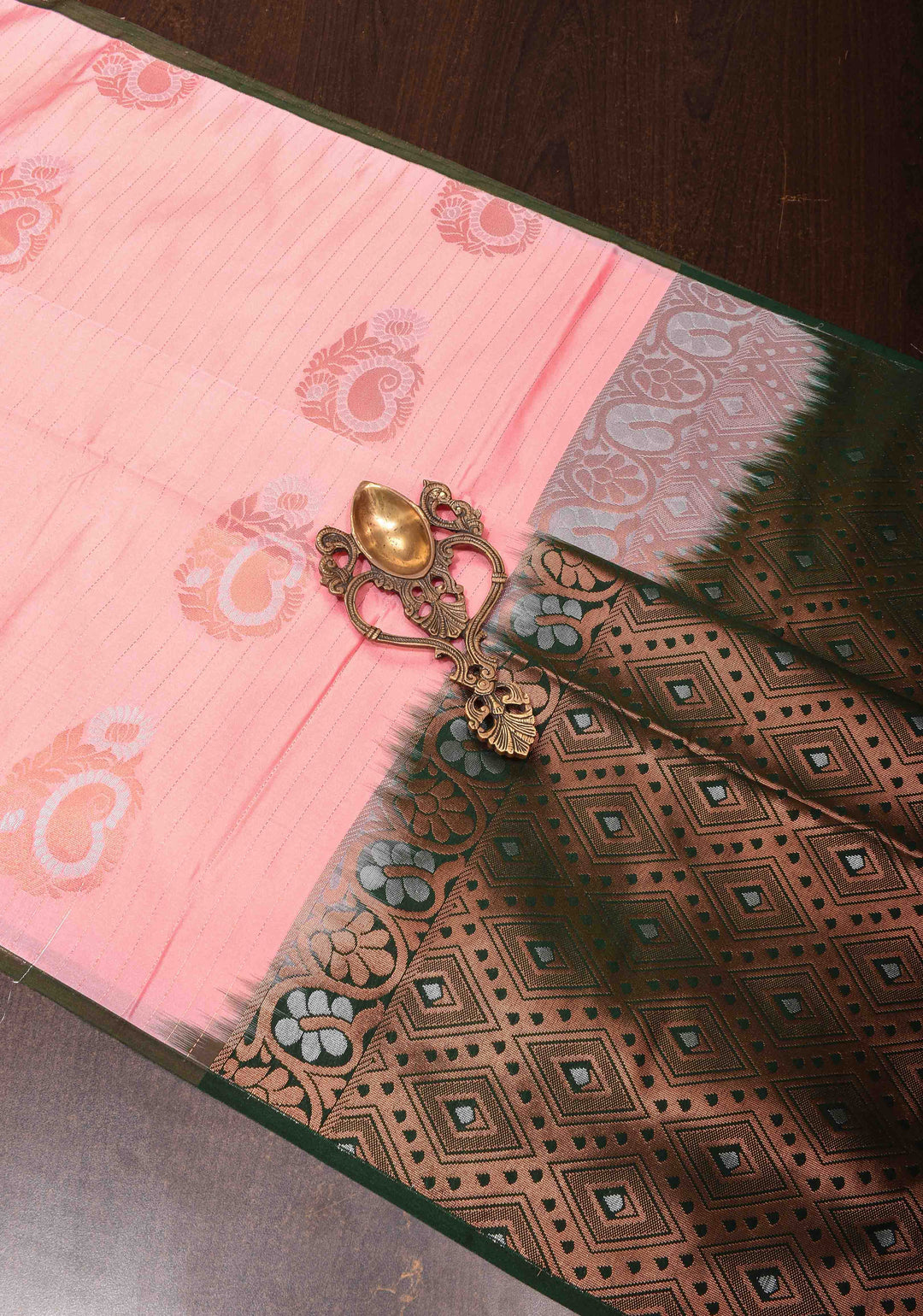 Graceful Peachy-Pink Semi  Silk Saree with Intricate Golden Motifs and Contrast Green Border