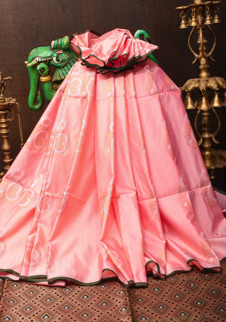 Graceful Peachy-Pink Semi  Silk Saree with Intricate Golden Motifs and Contrast Green Border