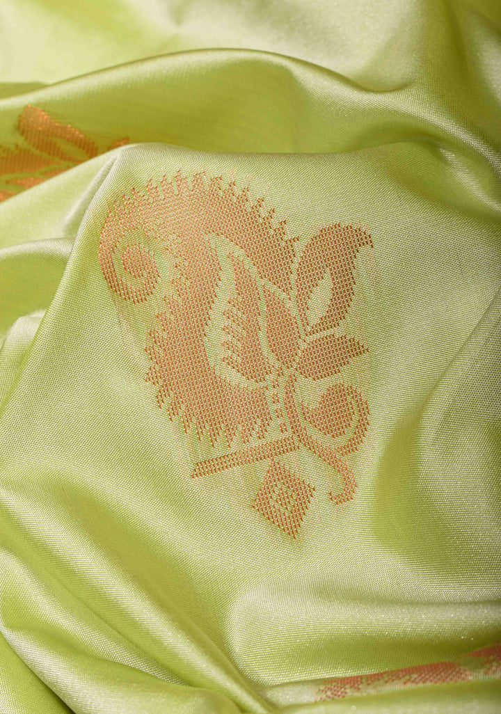 Tea Green Semi Silk Saree with Zari Buttas and Distinct Zari Motifs on Border