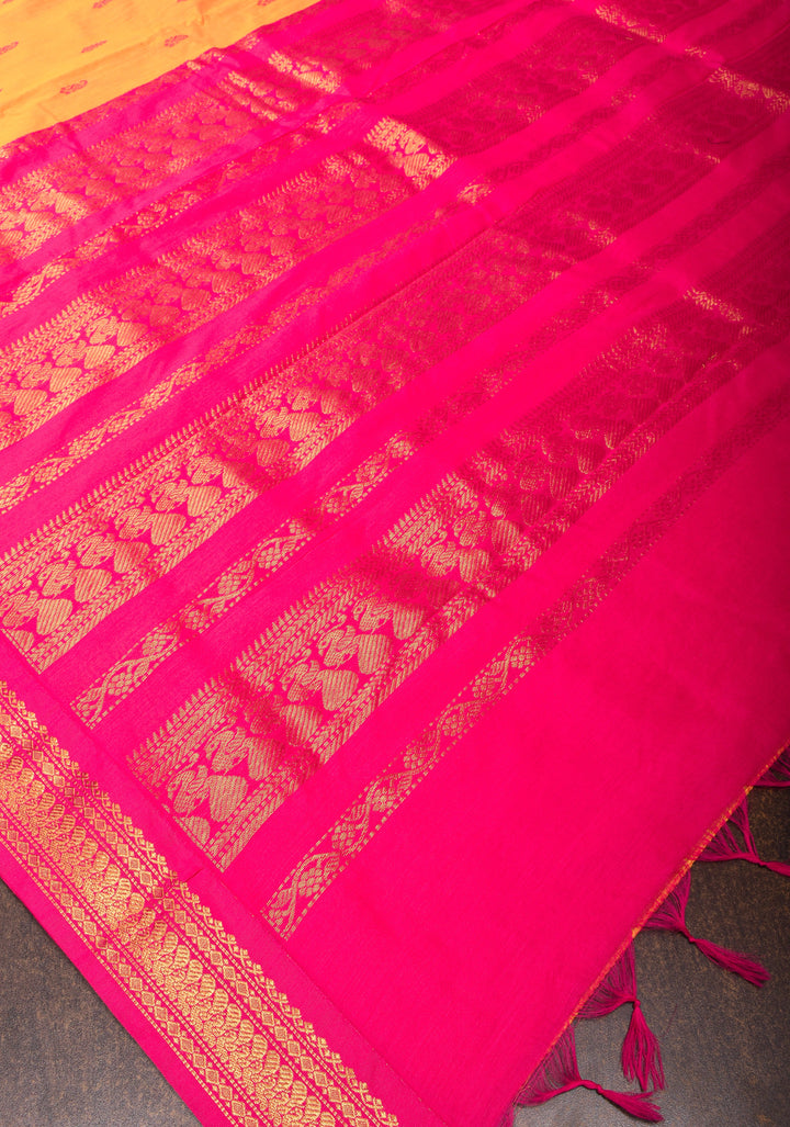Cotton silk saree in yellow with Pink contrast Border