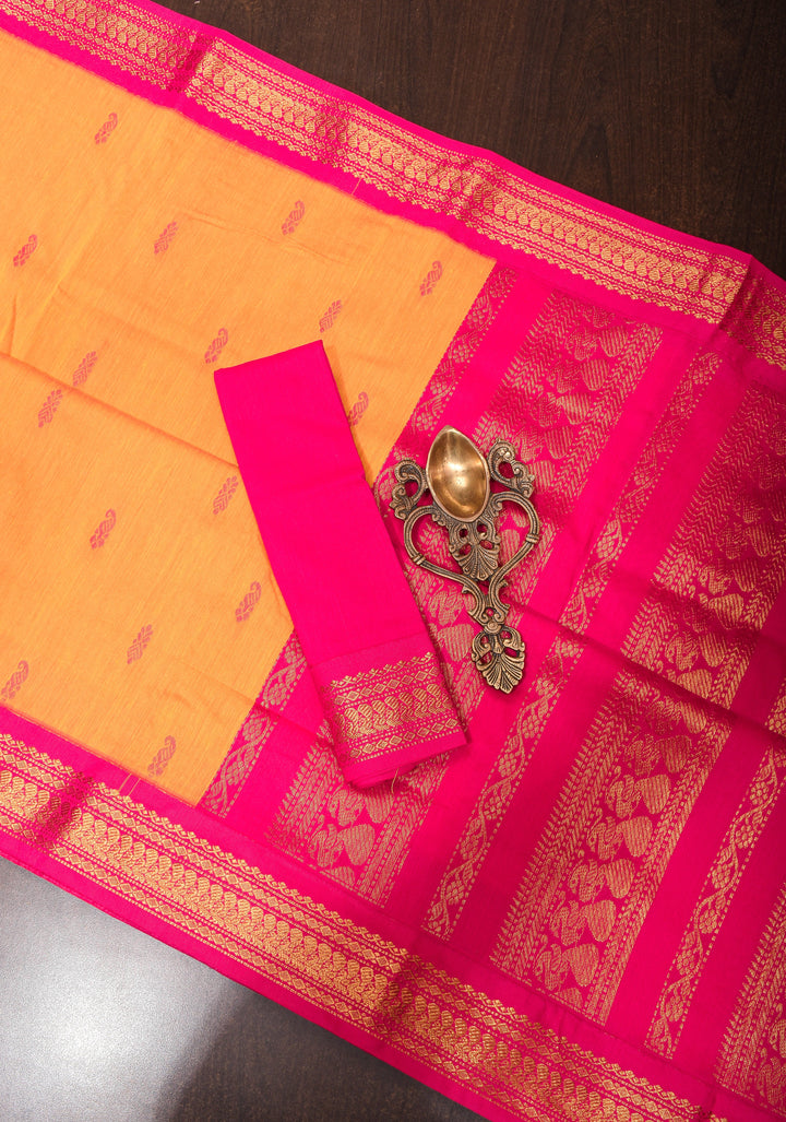 Cotton silk saree in yellow with Pink contrast Border