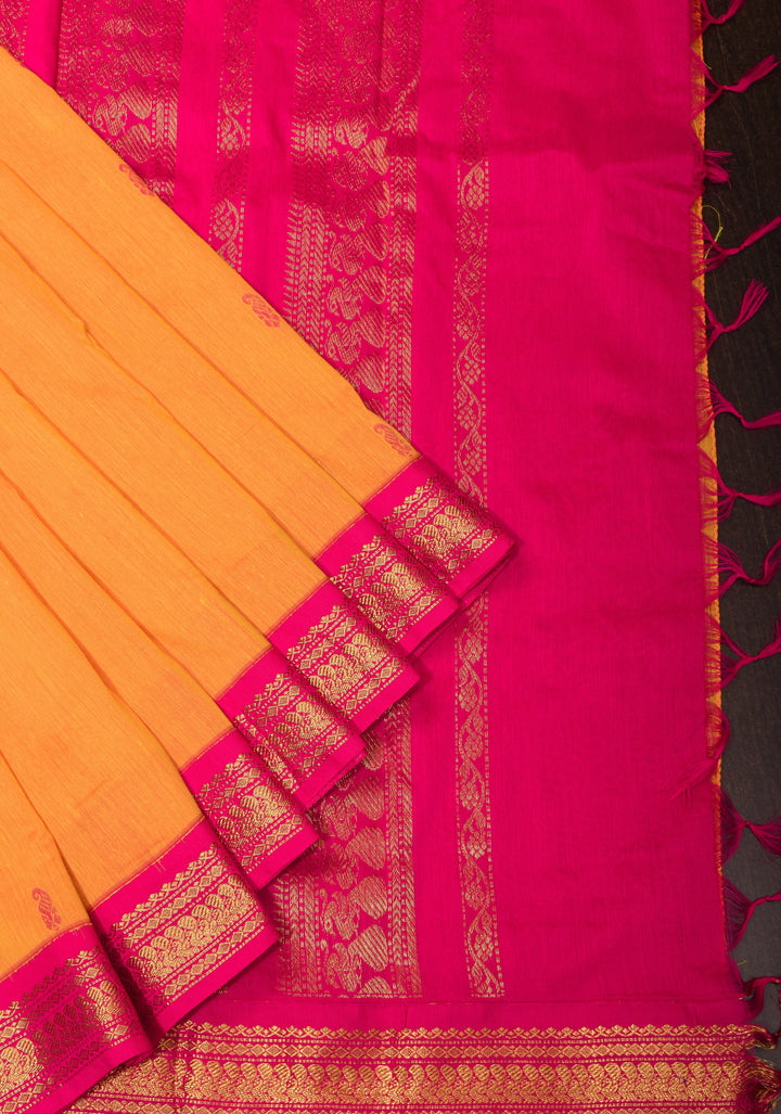 Cotton silk saree in yellow with Pink contrast Border