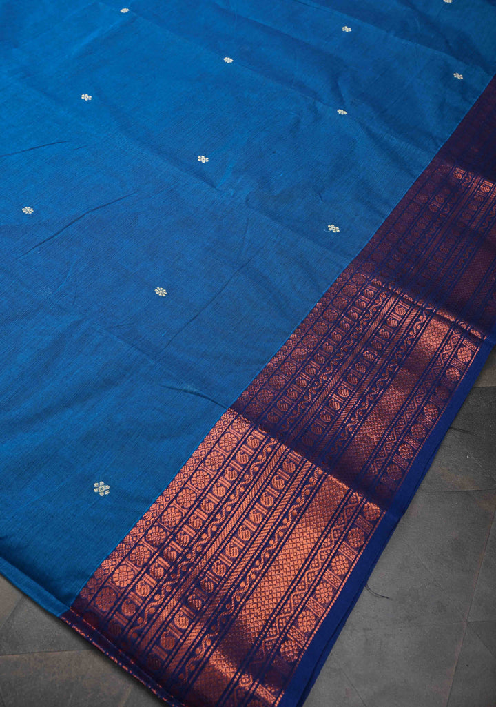Sapphire Blue Kanchi Cotton Saree with Floral Buttas And Contrast Zari Border