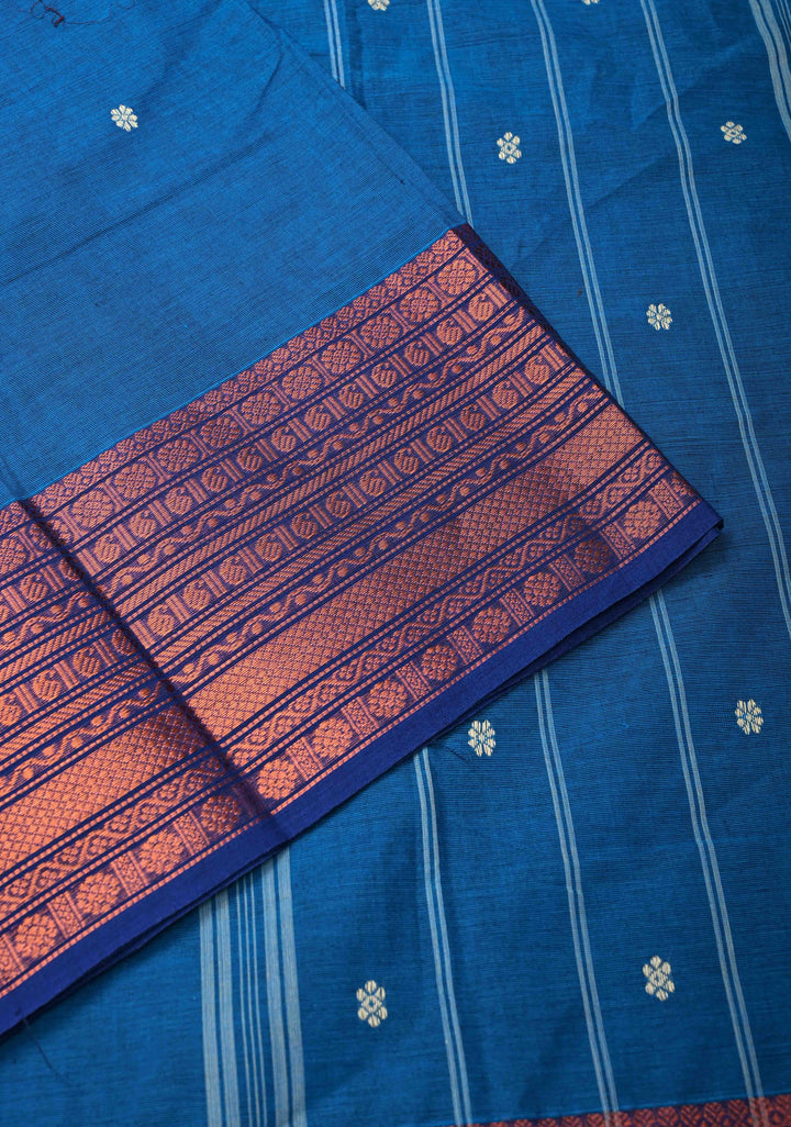 Sapphire Blue Kanchi Cotton Saree with Floral Buttas And Contrast Zari Border