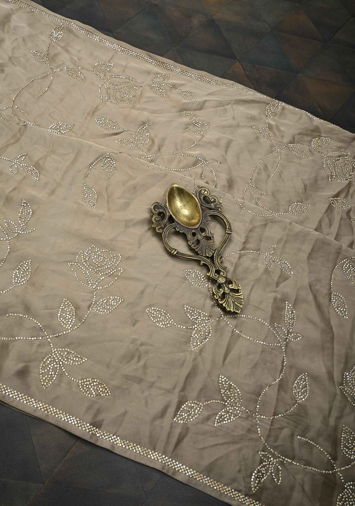 Taupe Satin saree with stone embellishments