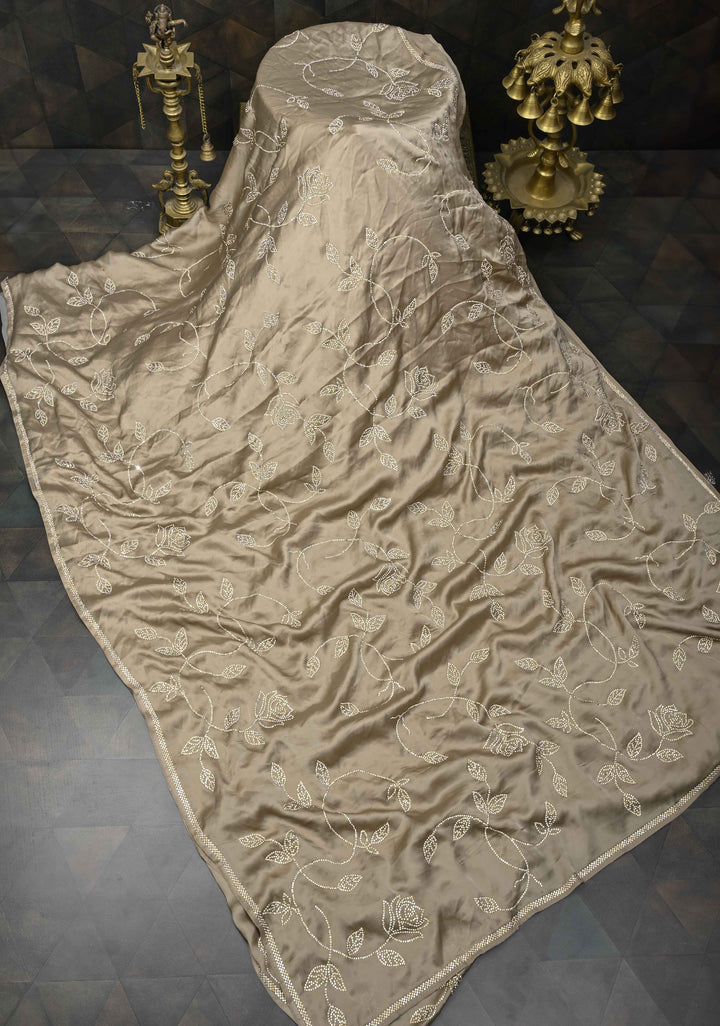 Taupe Satin saree with stone embellishments