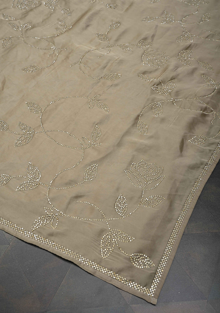 Taupe Satin saree with stone embellishments