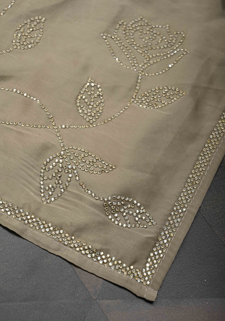 Taupe Satin saree with stone embellishments