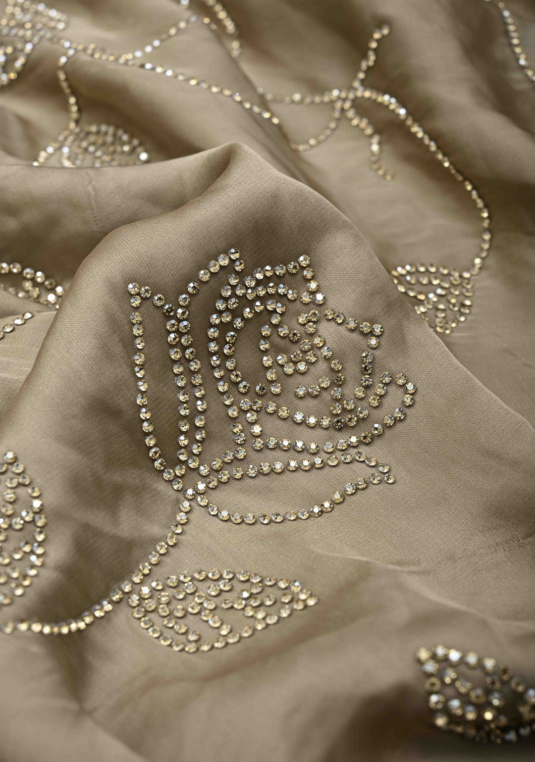 Taupe Satin saree with stone embellishments