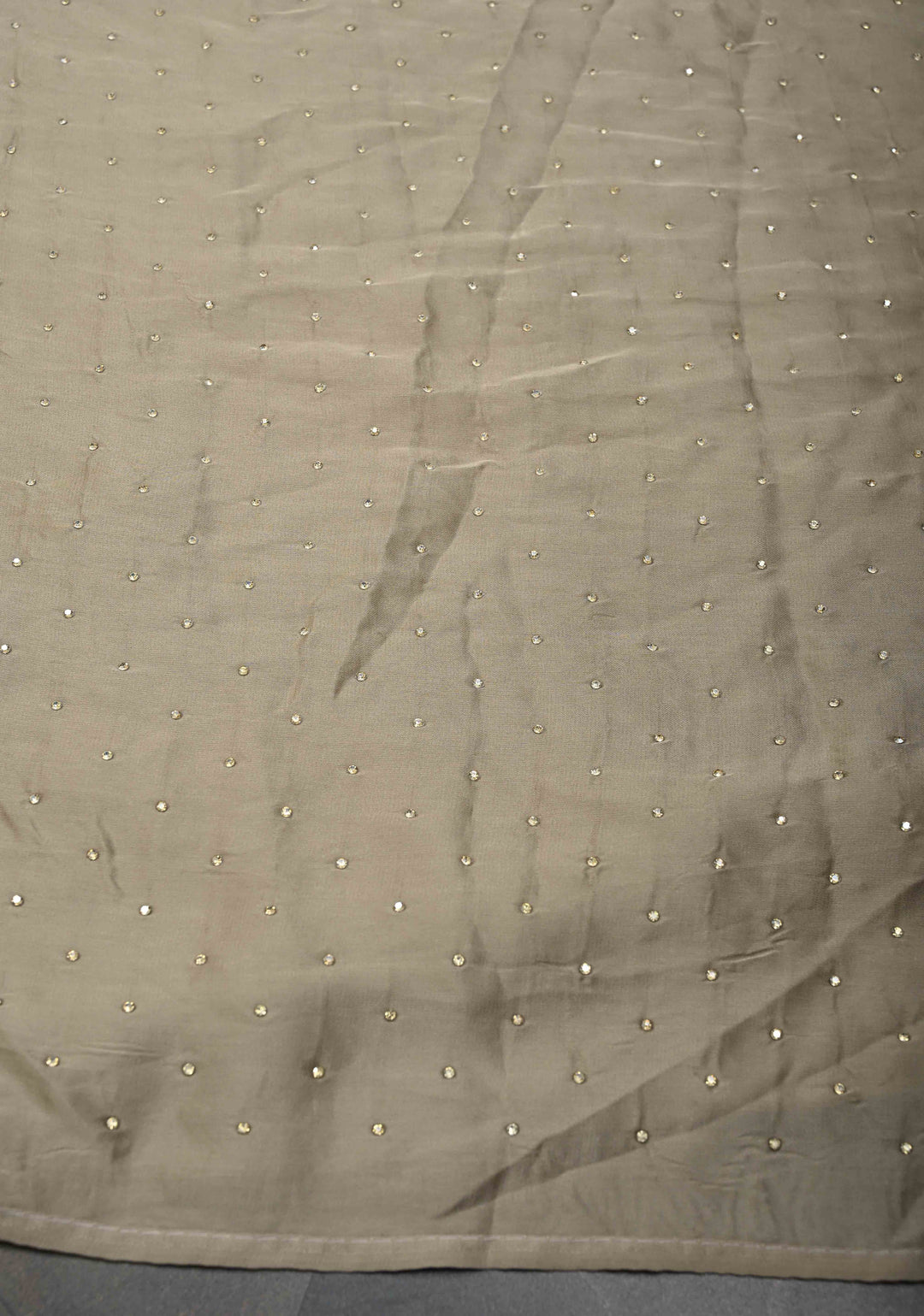 Taupe Satin saree with stone embellishments