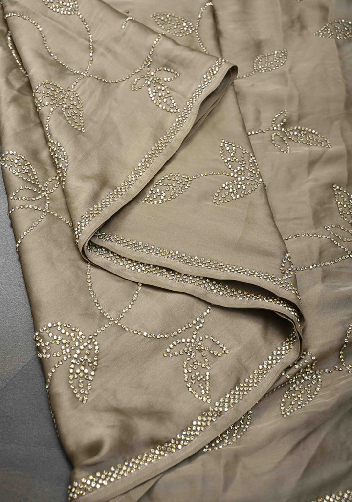 Taupe Satin saree with stone embellishments
