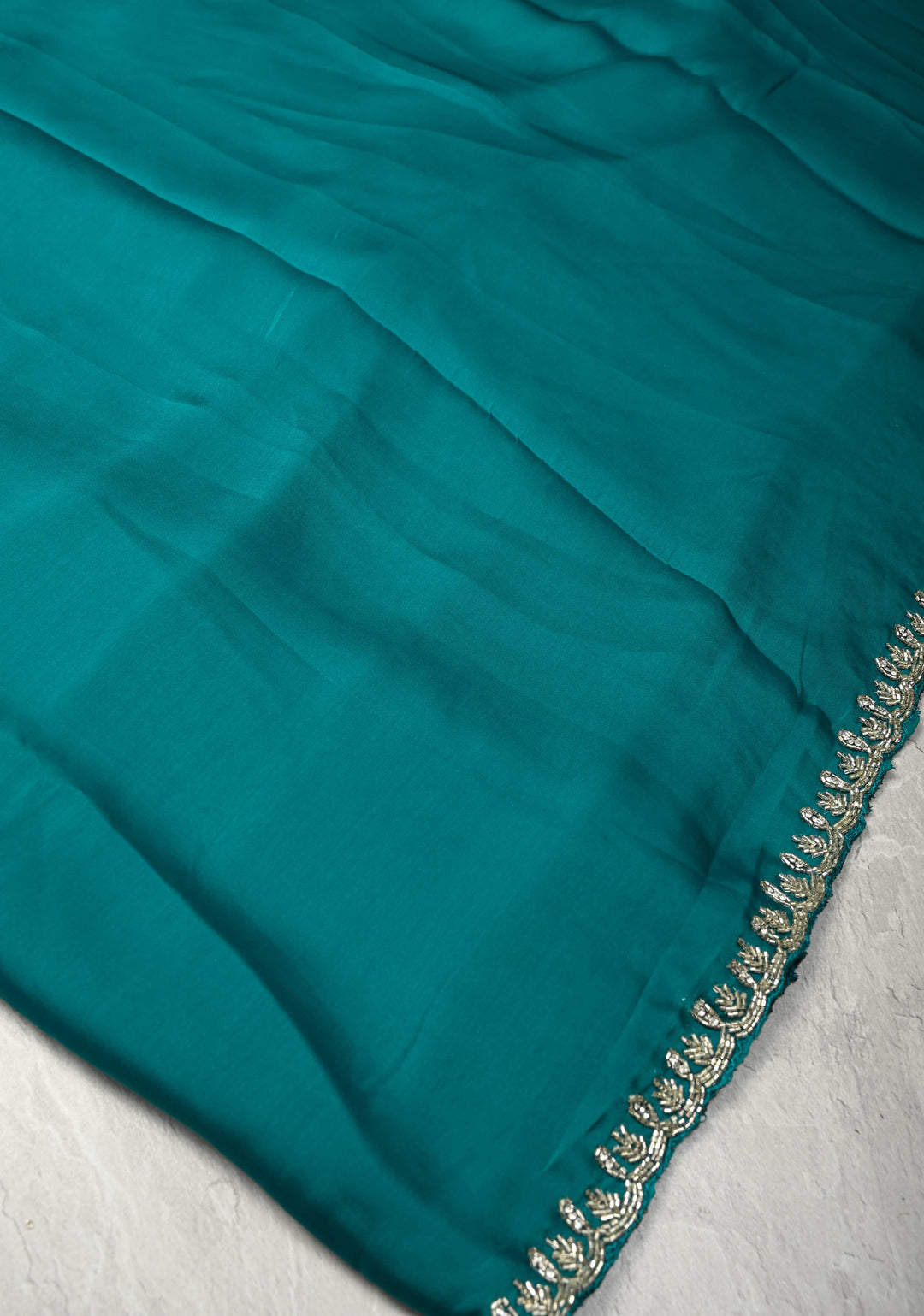 Teal  Satin Geoergette Saree with minimal cutdana borders