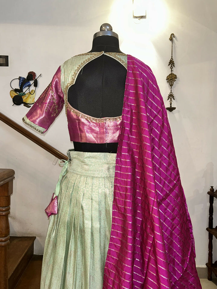 Yuvathi Mint green silk half Saree lehenga set with aari work