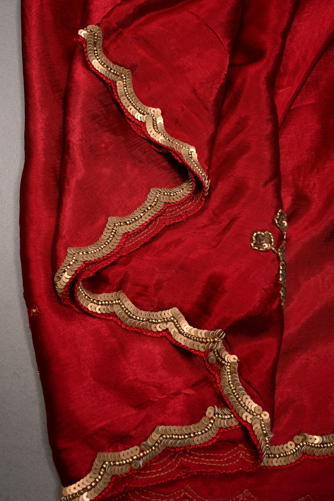 Red Satin Georgette Saree with Antique Matte Finish Cutdana, Sequins and Moti Embellishment and Scallop Border | SHOBITAM