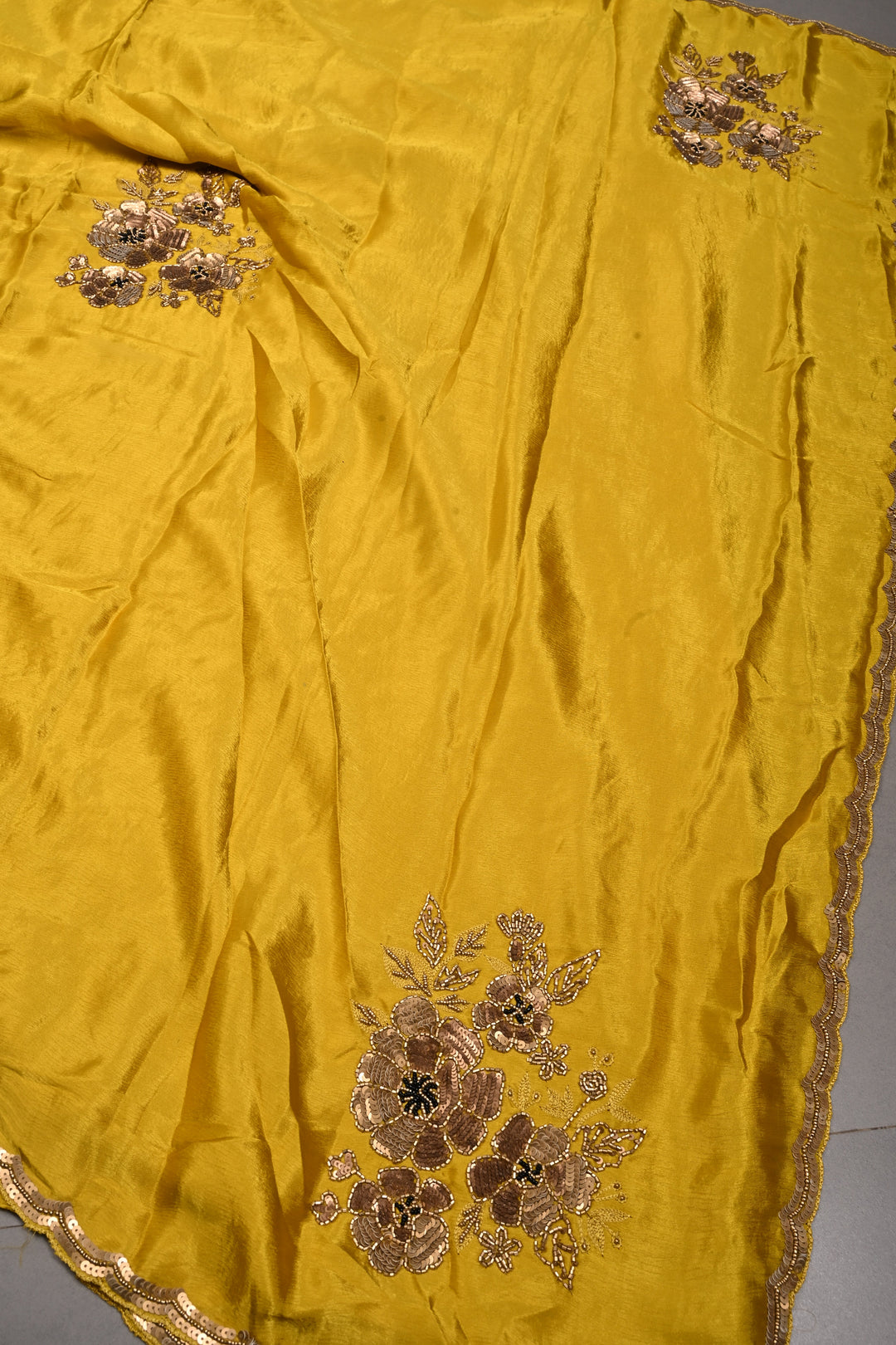 Moss Yellow Satin Georgette Saree with Antique Matte Finish Cutdana, Sequins and Moti Embellishment and Scallop Border | SHOBITAM