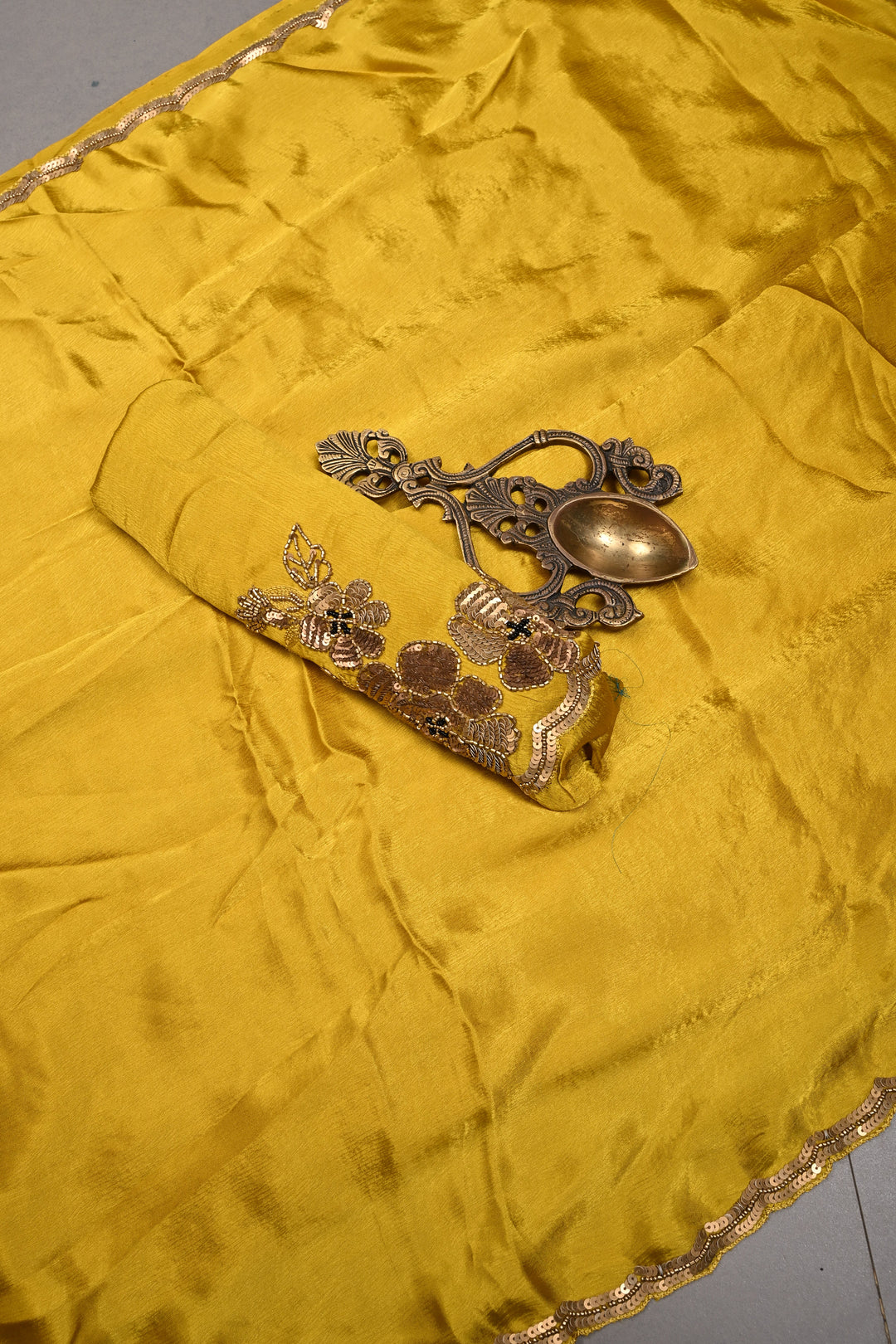 Moss Yellow Satin Georgette Saree with Antique Matte Finish Cutdana, Sequins and Moti Embellishment and Scallop Border | SHOBITAM