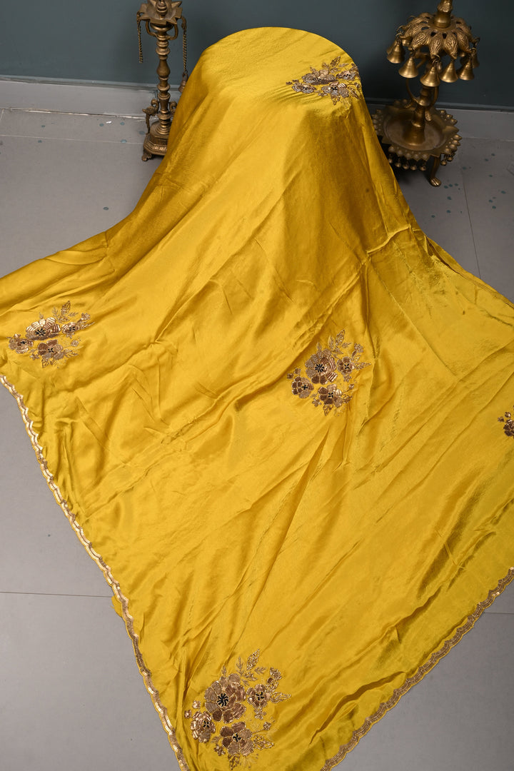 Moss Yellow Satin Georgette Saree with Antique Matte Finish Cutdana, Sequins and Moti Embellishment and Scallop Border | SHOBITAM