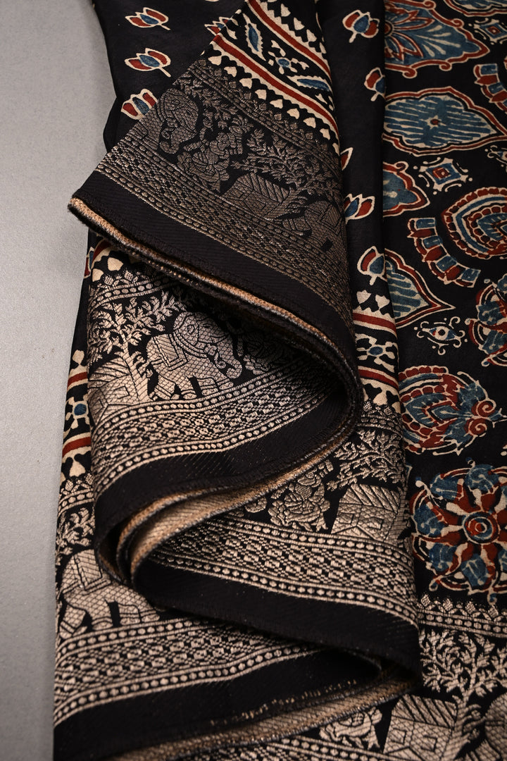 Black Ajrakh Hand Block Print on Dola Silk Saree with Fancy Zari Border | SHOBITAM