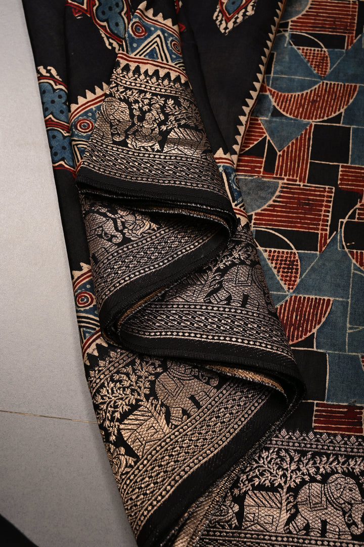 Black Ajrakh Hand Block Print on Dola Silk Saree with Fancy Zari Border | SHOBITAM