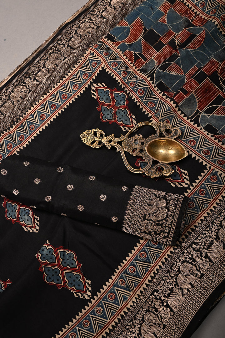 Black Ajrakh Hand Block Print on Dola Silk Saree with Fancy Zari Border | SHOBITAM