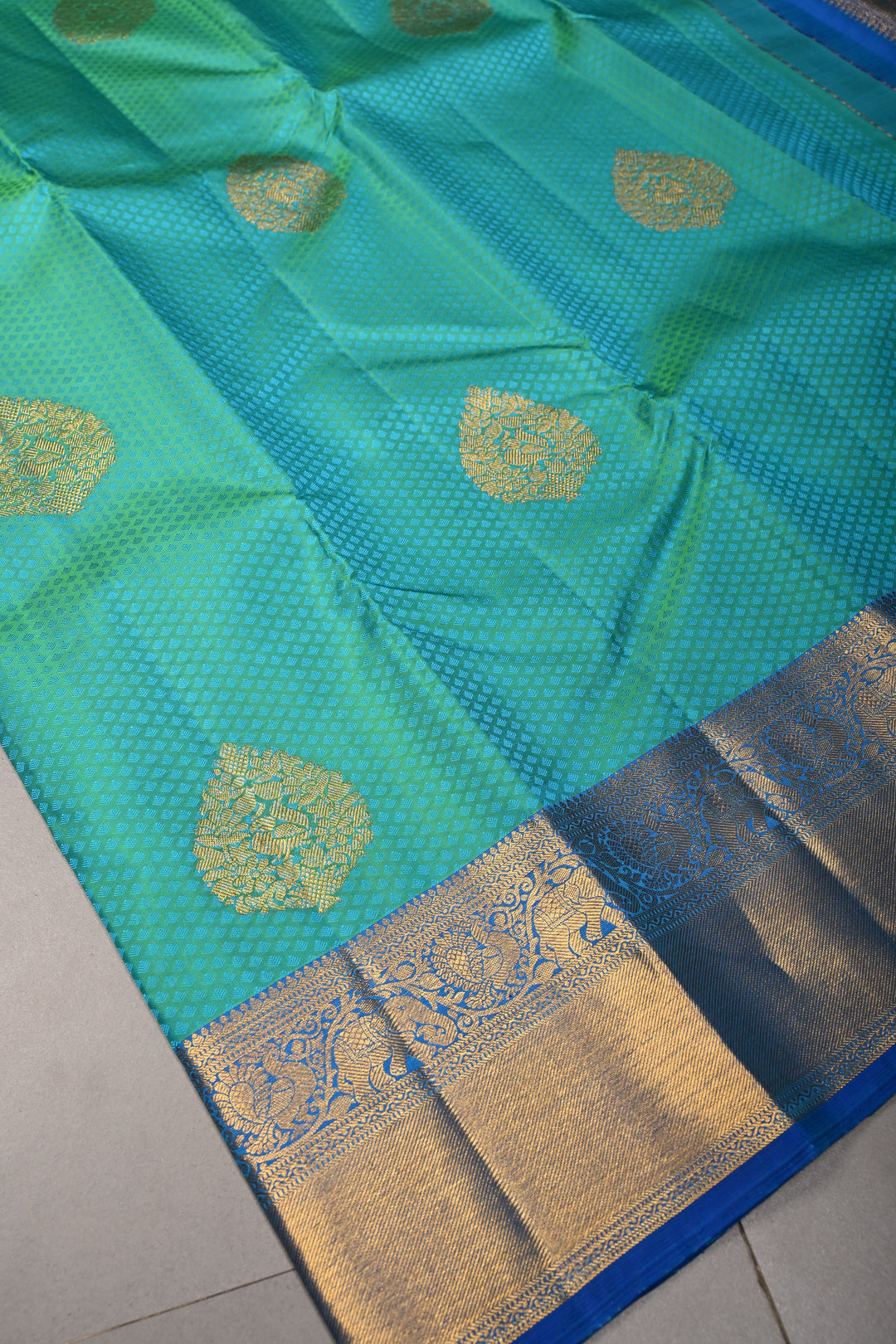 Blue-Green Dual Tone Self Brocade on Kanjivaram Pure Silk Saree with Damask Zari Buttas and Zari Border | SILK MARK CERTIFIED | SHOBITAM