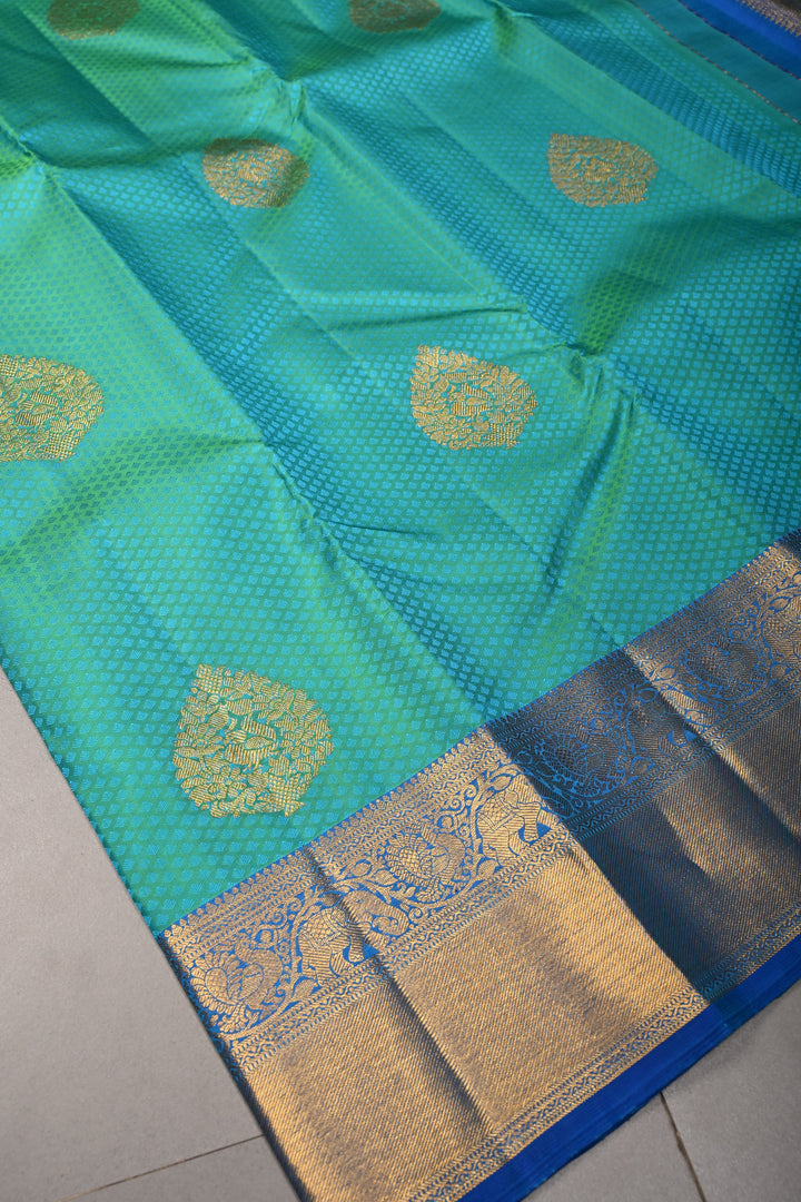 Blue-Green Dual Tone Self Brocade on Kanjivaram Pure Silk Saree with Damask Zari Buttas and Zari Border | SILK MARK CERTIFIED | SHOBITAM