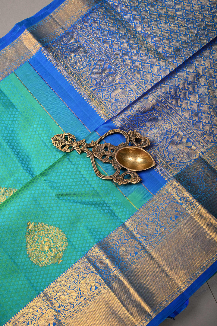 Blue-Green Dual Tone Self Brocade on Kanjivaram Pure Silk Saree with Damask Zari Buttas and Zari Border | SILK MARK CERTIFIED | SHOBITAM