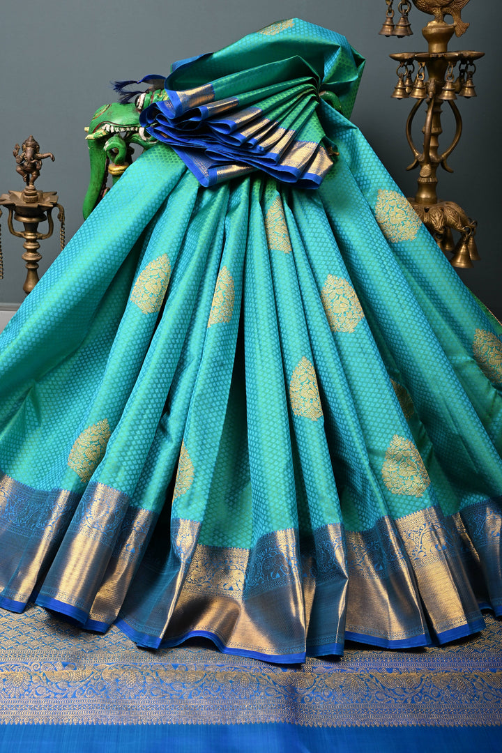Blue-Green Dual Tone Self Brocade on Kanjivaram Pure Silk Saree with Damask Zari Buttas and Zari Border | SILK MARK CERTIFIED | SHOBITAM