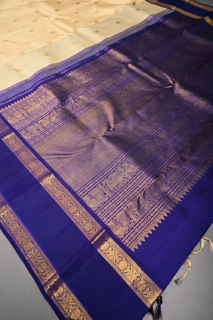 Cream Korvai Kanjivaram Pure Silk Saree with Zari Buttas and Contrast Zari Border | SILK MARK CERTIFIED | SHOBITAM