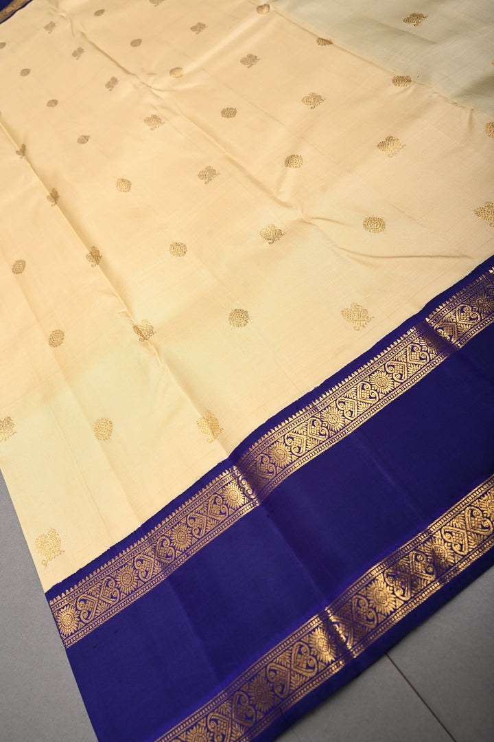 Cream Korvai Kanjivaram Pure Silk Saree with Zari Buttas and Contrast Zari Border | SILK MARK CERTIFIED | SHOBITAM